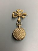 A lady's early 20th century yellow metal and seed pearl set fob watch, on a 18ct and seed pearl