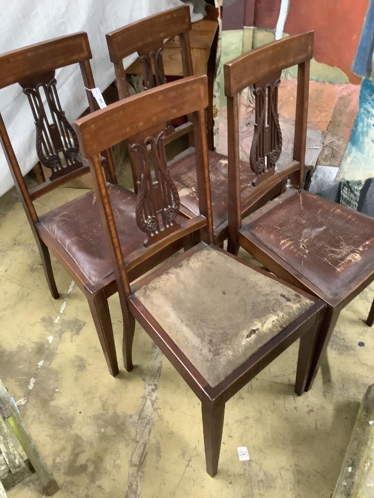 A set of four Edwardian satinwood banded lyre back dining chairs