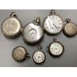 A silver half hunter pocket watch and six other white metal pocket or fob watches