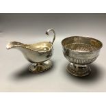 A late Victorian demi fluted silver sugar bowl, Chester 1899, and an Edwardian silver pedestal