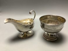 A late Victorian demi fluted silver sugar bowl, Chester 1899, and an Edwardian silver pedestal