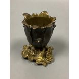 A small bronze 'tulip head' vase with gilt 'dragon' base, height 9cm