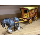 A large painted wood model Gypsy caravan and ceramic horse, overall length 85cm