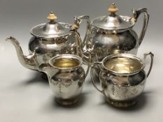 An Edwardian engraved silver four piece tea and coffee service, John round and Sons, Sheffield,