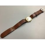 A gentleman’s 1930’s 9 carat gold manual wind wristwatch, on leather strap, case diameter 28 mm