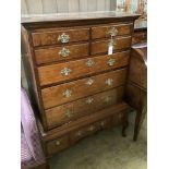 An 18th century oak chest on stand, width 100cm, depth 54cm, height 140cm