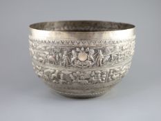 A large late 19th century Indian export embossed silver bowl,decorated with animals, figures, birds