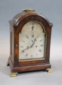 A George III eight day mahogany and brass mounted bracket clock,the silvered arch dial with Roman