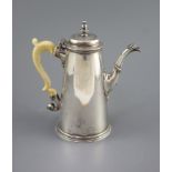 A George II silver coffee pot, by Robert Lucas,of tapering cylindrical form, with ivory handle,