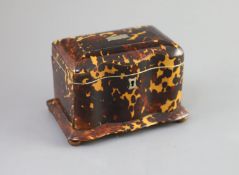A 19th century tortoiseshell tea caddy,of serpentine form, with a hinged cover and two interior