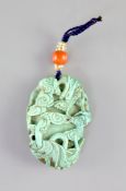 A Chinese turquoise matrix ‘dragon’ pendant, 19th centurycarved in high relief and openwork with a