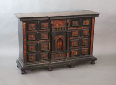 A late 17th century Portuguese ebony and tortoiseshell table cabinet,of breakfront rectangular form