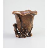 A Chinese bamboo ‘magnolia’ libation cup, 17th/18th century,carved as a magnolia flower, with
