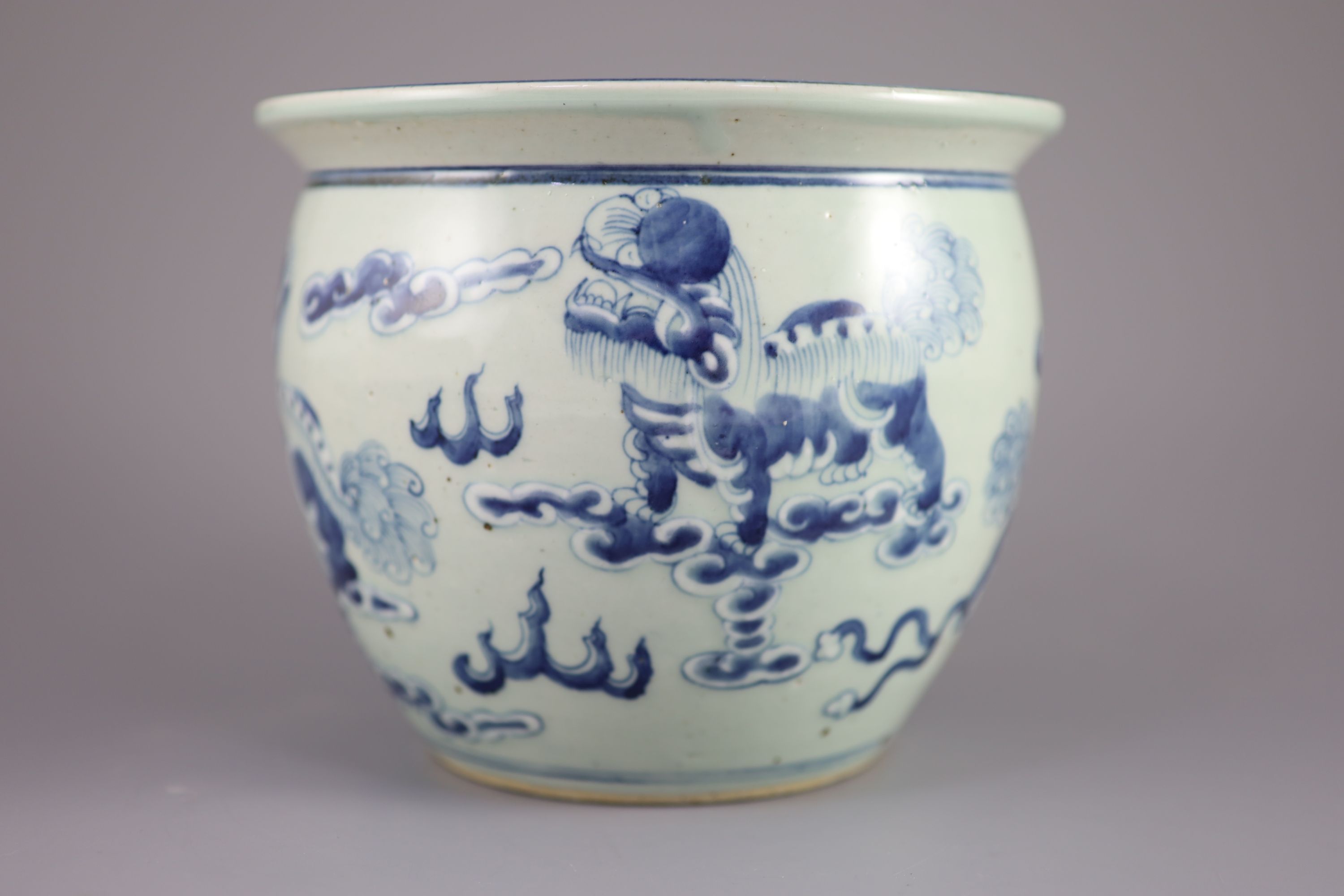A Chinese blue and white 'lion-dog' flower pot,painted with lion-dogs on white slip, on a pale - Image 4 of 6