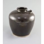 A Chinese Henan wine jar, Song-Yuan dynasty,covered in a dark brown glaze, with single spout,23.5cm