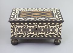 An early 18th century Dutch Colonial casket,inlaid with bone and ebony, the hinged cover revealing