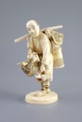 A Japanese ivory okimono of a basket seller, early 20th centuryhis wares with polychrome inlay, two