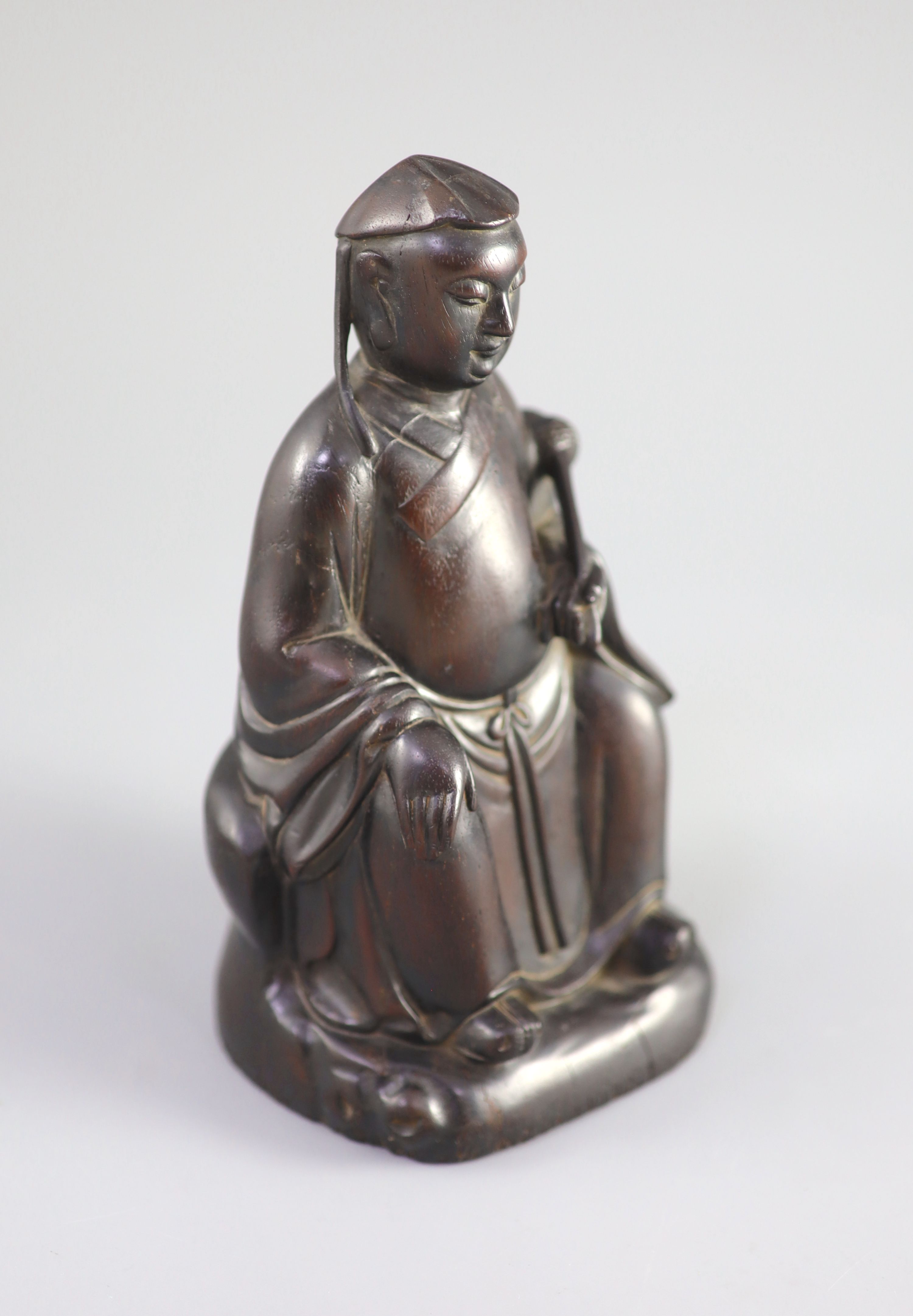 A Chinese Zitan seated figure of an official, 18th century,the figure holding a fly whisk in his - Image 2 of 5