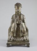 A Chinese bronze seated figure of Wenchang Wang, late Ming dynasty, 17th century,on a stepped base