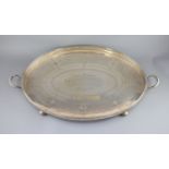 An Edwardian silver two handled oval tea tray, by Walker & Hall,with pierced gallery, on ball feet,