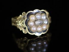 A William IV 18ct gold, black enamel and seed pearl set mourning ring,with central rock crystal?