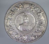 A large late 19th century Italian repousse 800 standard silver charger,decorated with ancient Roman