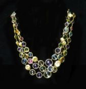 A modern Italian gold and graduated multi gem set three row spectacle necklace by Marco Bicego,with