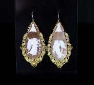 A pair of Victorian gold mounted cameo shell teardrop shaped drop earrings,each carved with an