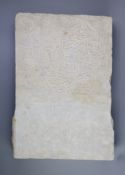 An Islamic inscribed marble slab, 16th century,with a Kufic inscription to a roundel on the front,
