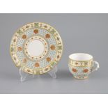 A Royal Worcester 'jewelled' and reticulated cup and saucer, c.1870,decorated with raised jewelling