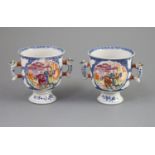 A pair of Chinese famille rose two handled cups, Qianlong period,each painted with mandarin figures
