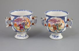 A pair of Chinese famille rose two handled cups, Qianlong period,each painted with mandarin figures