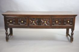 A late 17th century oak dresser,fitted with three geometric moulded short drawers, raised on turned