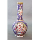 A massive Chinese famille rose blue ground bottle vase, Daoguang period (1821-50),well painted to