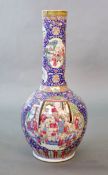 A massive Chinese famille rose blue ground bottle vase, Daoguang period (1821-50),well painted to
