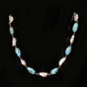 An early 20th century Liberty & Co? 15ct gold, baroque pearl and oval turquoise bead set necklace,