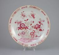 An unusual Chinese export famille rose dish, Yongzheng/Qianlong period,painted with flowers and