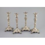 A set of four early 19th century South American? cast silver candlesticks,with waisted knop stems