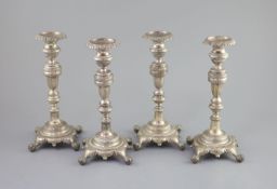 A set of four early 19th century South American? cast silver candlesticks,with waisted knop stems