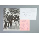 The Beatles, a set of four autographs on pink paper and a contemporary promotional photo signed by