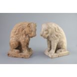 A pair of European pink marble seated lions, 18th century or earlier,the marble possibly rose