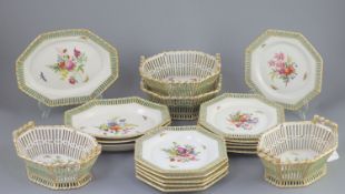 A Berlin porcelain dessert service, mid 19th century,each piece of octagonal shape, painted with