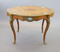 A Victorian Louis XV style ormolu mounted walnut centre table,inset with Sevres style porcelain