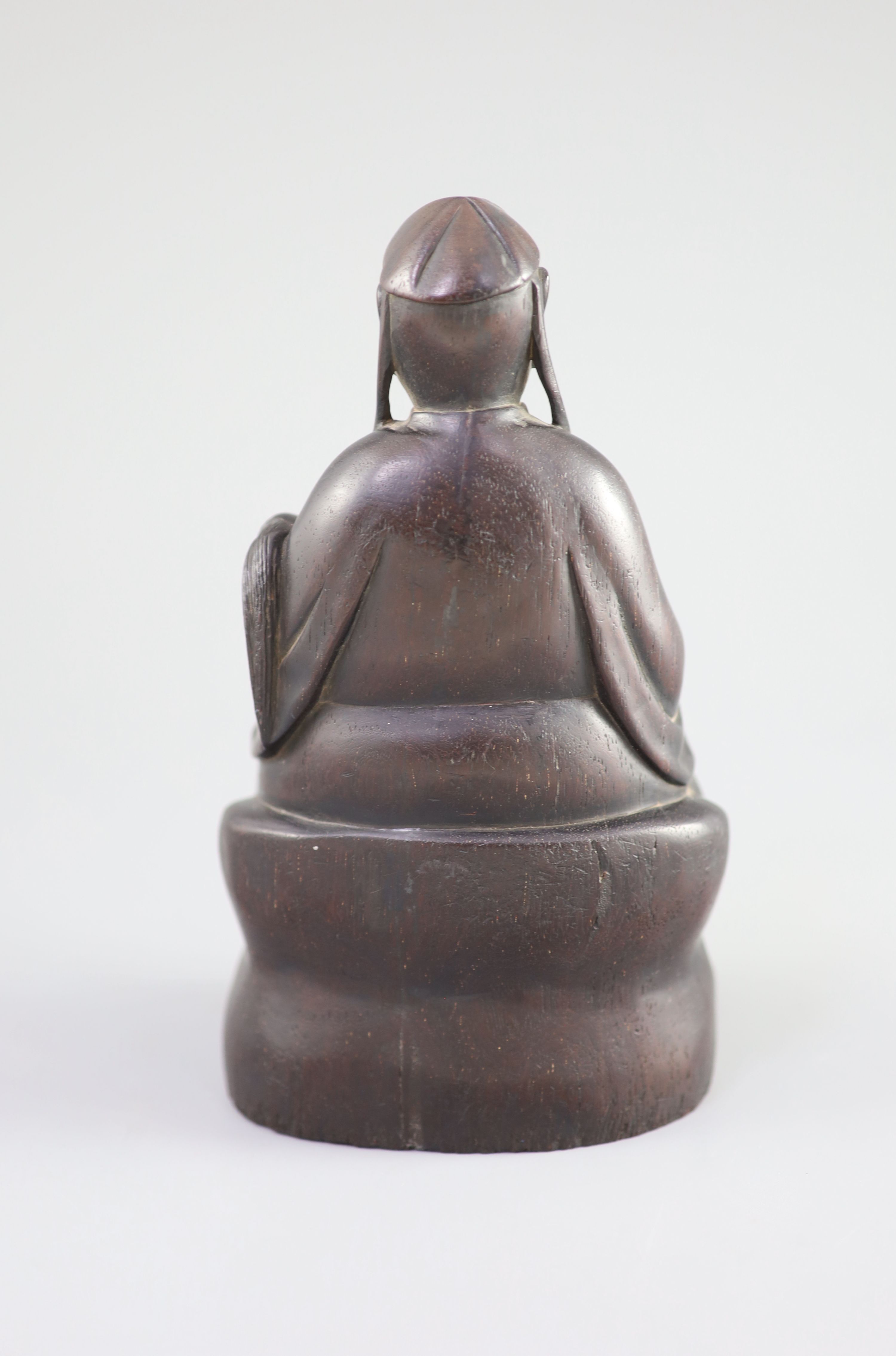 A Chinese Zitan seated figure of an official, 18th century,the figure holding a fly whisk in his - Image 4 of 5