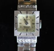 A lady's mid to late 20th century platinum and diamond set Rolex manual wind wrist watch on an 18ct