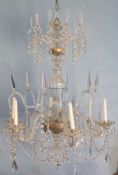 A large George III cut-glass six light chandelier, c.1780,surmounted with ten twisted stems united