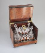 A Victorian burr yew decanter box, c1880the serpentine cover opening to reveal a two tier interior