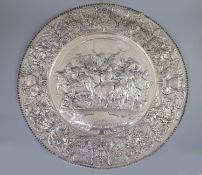 A large late 19th century Italian repousse 800 standard silver charger,decorated with ‘La Battaglia