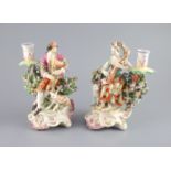 A pair of Chelsea Derby musician candlestick figures, c.1770,the gentleman playing the bagpipes