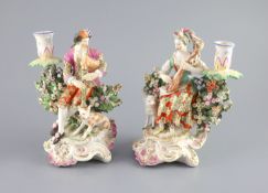 A pair of Chelsea Derby musician candlestick figures, c.1770,the gentleman playing the bagpipes